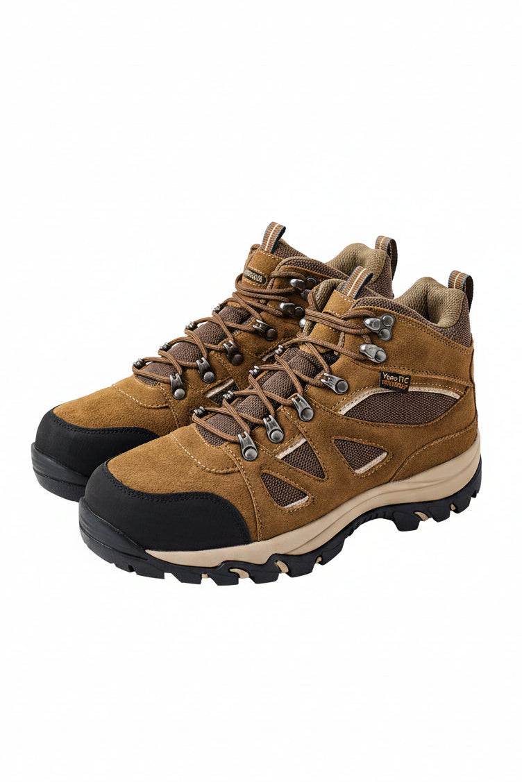 Pair of brown hiking boots with black soles on a white background