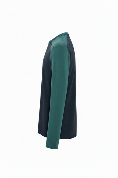 Side view of a dark green and charcoal long-sleeve shirt on a white background